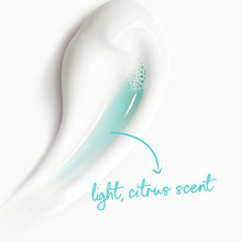 Body wash swirl with light citrus scent graphic and teal arrow