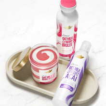 Dove body scrub set with jar and bottles on round tray, assortment shown
