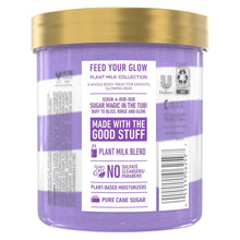 Back of Dove sugar scrub jar with purple label and information panel