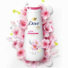 Dove uplift body wash bottle surrounded by pink Sakura blossoms and white foam