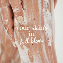 Creamy lather on skin with text 'your skin's in full bloom'