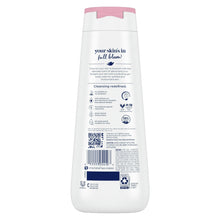 Body wash bottle with pink cap and white label, side view