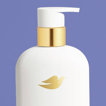 White body wash bottle with gold pump dispenser