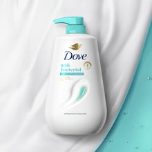 Dove antibacterial body wash bottle with teal pump, label text visible