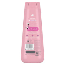 Back view of a pink body wash bottle with nutrition and usage info panel.