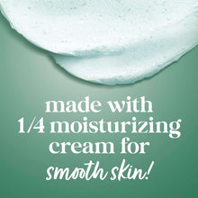 Pale mint body scrub cream with textured foam, shown near the jar opening