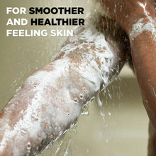 Charcoal + clay body wash lather on skin under running water