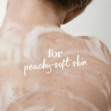 Moisturizing body wash lather on skin over shoulders