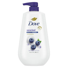 Body wash bottle with purple pump and unwind blueberry label on front.