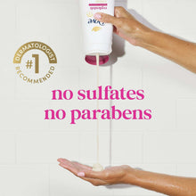 Hand dispensing body wash from a bottle onto an open palm