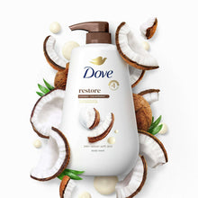 Dove Restore body wash bottle with coconut halves and milk drops around it