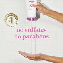 Dove body wash bottle dispensing into open palm under water