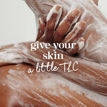 Dove body wash foam on hands and skin, with suds and creamy lather