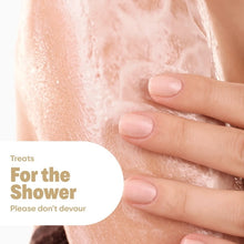 Hand massaging Dove x crumbl body scrub texture on skin