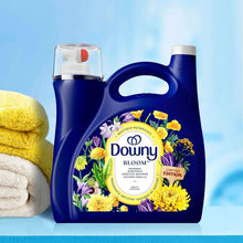 Fabric softener jug with blue handle and Bloom floral label, white cap