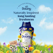 Downy Bloom limited edition scent booster beads pouch in an outdoor floral scene.