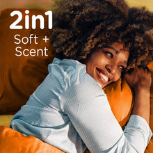Fabric softener scented towels with person holding them, 2-in-1 soft plus scent