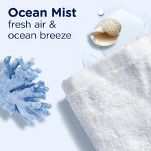 Ocean Mist scent booster beads with seashells and a white towel surface