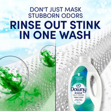 Downy Rinse Out Odor fabric rinse bottle with water splash, tough odors