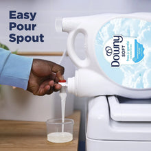 Downy Soft Free & Gentle liquid fabric softener pouring from an easy-pour spout