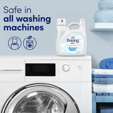 Downy liquid fabric softener bottle next to a front-load washing machine