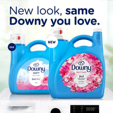 Two blue Downy fabric softener bottles side by side, April Fresh floral labels