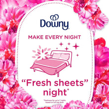 Downy Fresh sheets night packaging badge with bed icon and pink floral design
