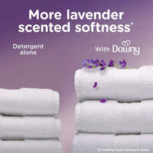 Folded white towels with lavender petals and Downy calm branding