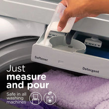 Liquid fabric softener poured into washer dispenser for softener compartment