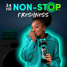 Downy Unstopables Fresh scent booster beads bottle held by a person, Non-Stop