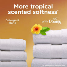 Fabric softener scent with Downy, stacked white towels and tropical flower accents