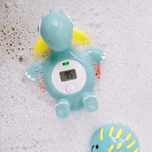 Floating baby bath thermometer dinosaur with digital temperature display, green body