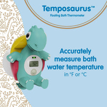 Teal dinosaur floating bath thermometer showing LCD temperature display for bath water.