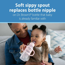 Baby drinking from a pink-and-clear anti-colic bottle with soft spout
