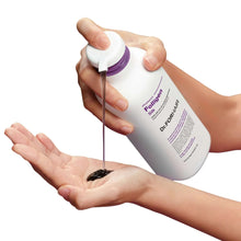 Hands dispensing Dr.FORHAIR Folligen Silk shampoo from white bottle onto palm