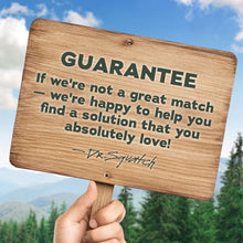 Dr. Squatch guarantee wooden card held in hand outdoors