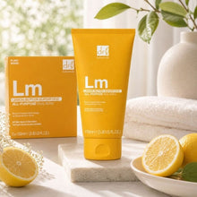 Dr. Botanicals Lemon body butter tube and box with lemons and spa items