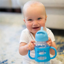 Blue sippy straw bottle with silicone handles in baby's hands