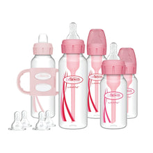 Set of pink and clear anti-colic baby bottles with caps and replacement nipples