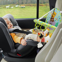 Baby car seat toy hanging animal and mirror on travel car seat beside infant