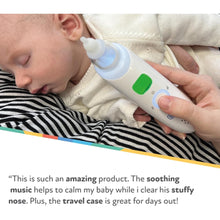 Baby using electric nasal aspirator, white device with soft suction tip and buttons