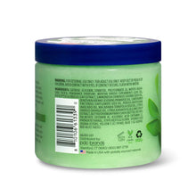 Shea sugar scrub back label with barcode and product details on green jar