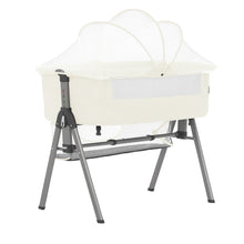 Ivory bedside bassinet with canopy net and storage basket on gray stand