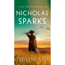 Nicholas Sparks Dreamland paperback book cover with woman in field at sunset