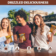 Mini rice cake variety pack held during outdoor picnic with three people