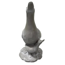 Duck statue, dark gray, upright neck with beak, standing on textured round base