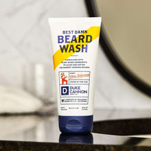 Beard wash tube angled view, white/blue tube with yellow and blue front text