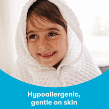 Hypoallergenic gentle-on-skin laundry detergent message with child in white hooded towel