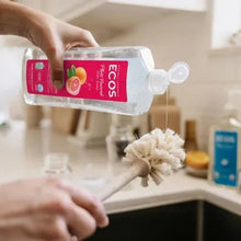 ECOS grapefruit liquid dish soap refill bottle being poured into pump dispenser