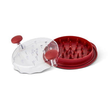 Red chicken shredder with clear top lid and red knob, shredder pins inside